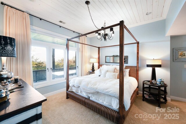 1052 Toxaway Dr, Lake Toxaway, NC 28747 - bedroom featuring french doors, light colored carpet, baseboards, a chandelier, and wood ceiling