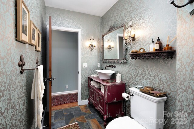 1052 Toxaway Dr, Lake Toxaway, NC 28747 - bathroom with stone tile flooring, toilet, and vanity