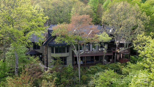1052 Toxaway Dr, Lake Toxaway, NC 28747 - rear view of property with a wooded view