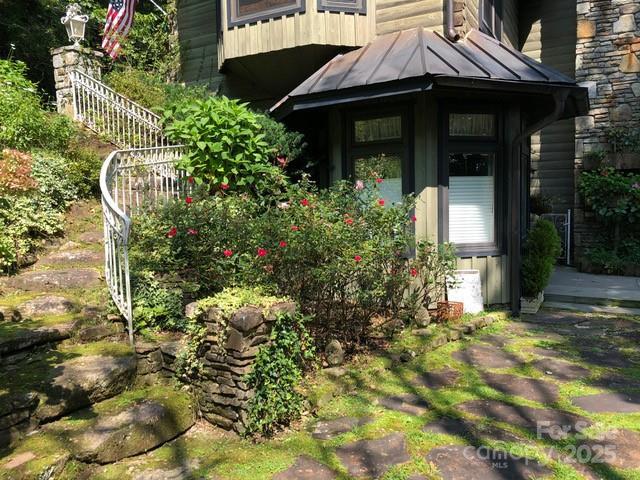 1052 Toxaway Dr, Lake Toxaway, NC 28747 - property entrance featuring a standing seam roof and metal roof