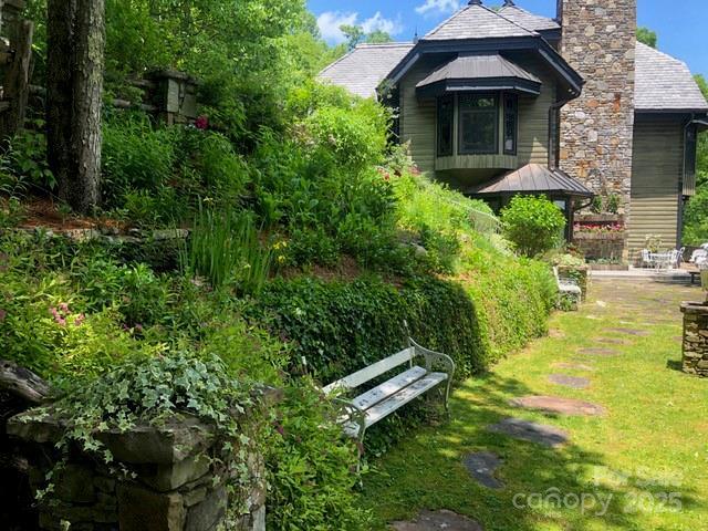 1052 Toxaway Dr, Lake Toxaway, NC 28747 - view of property exterior featuring a chimney