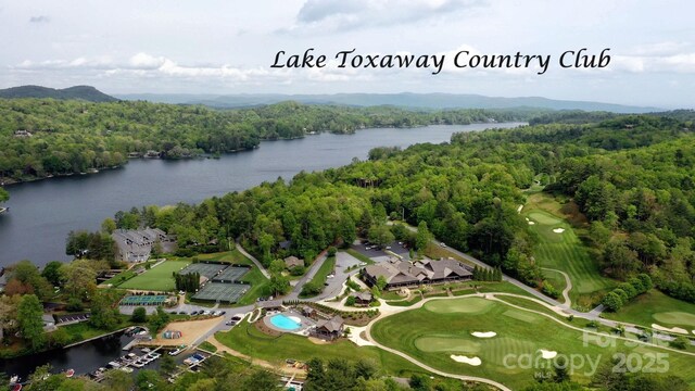 1052 Toxaway Dr, Lake Toxaway, NC 28747 - aerial view of a heavily wooded area, a large body of water, and a local golf course
