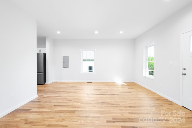 empty room with light hardwood / wood-style floors