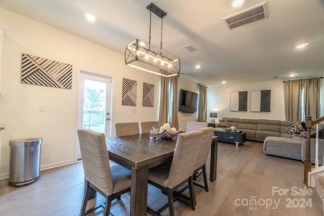 dining space featuring hardwood / wood-style floors