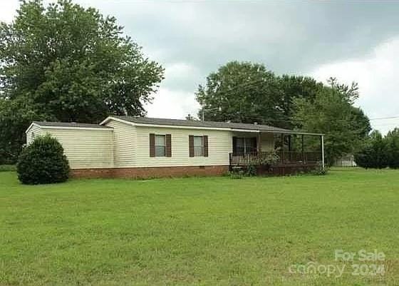 back of house with a yard