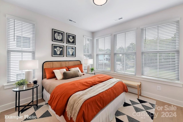 bedroom with light hardwood / wood-style flooring