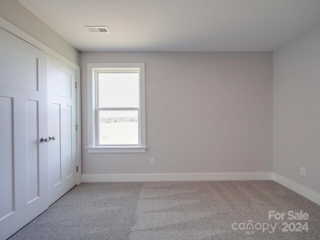 spare room with carpet