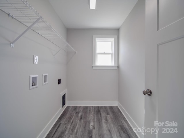 laundry room featuring dark hardwood / wood-style flooring, electric dryer hookup, and washer hookup