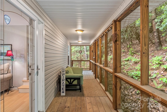 wooden terrace featuring covered porch