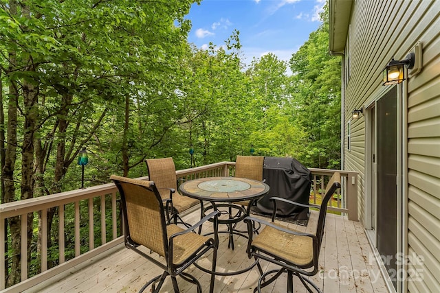 wooden deck with grilling area