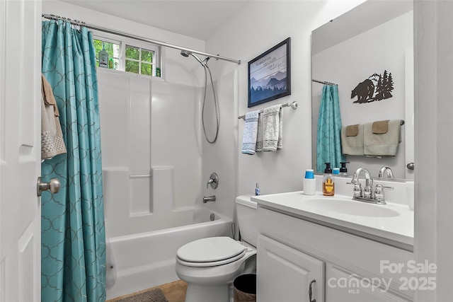 full bathroom featuring shower / tub combo, vanity, and toilet