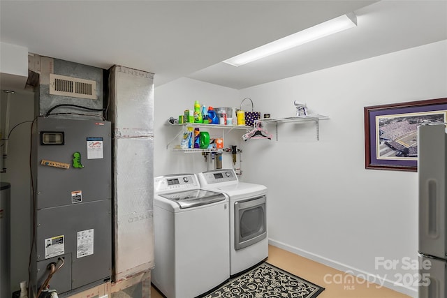 laundry room featuring washer and dryer