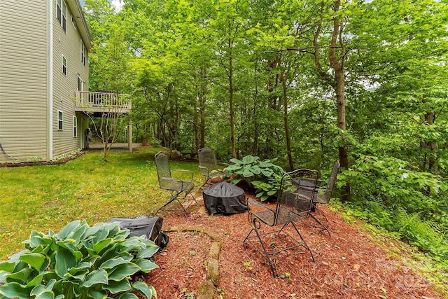 view of yard featuring a wooden deck