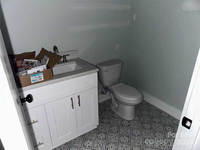 bathroom with toilet and vanity