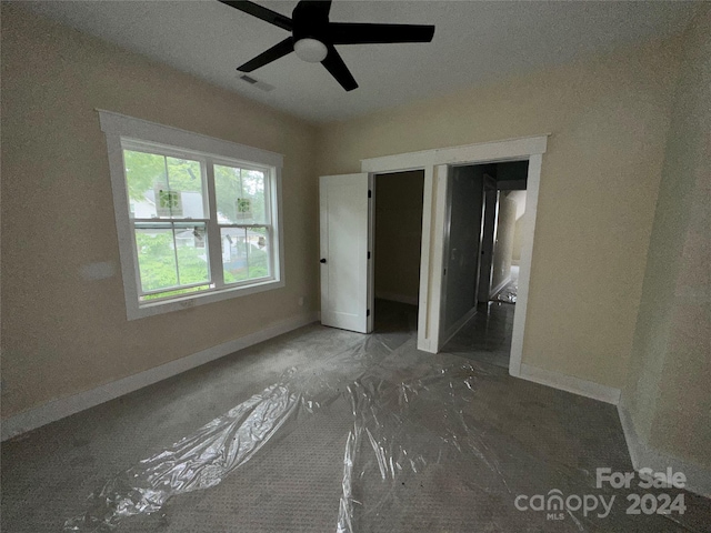 unfurnished bedroom with ceiling fan