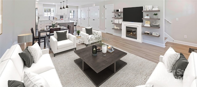 living room with light hardwood / wood-style flooring