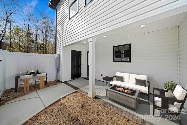 view of patio / terrace with an outdoor fire pit