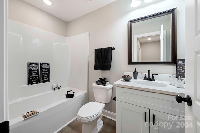 full bathroom featuring  shower combination, hardwood / wood-style flooring, vanity, and toilet