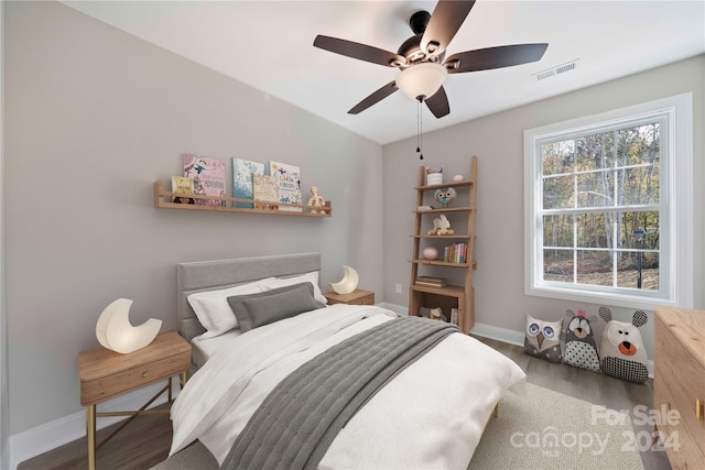 bedroom featuring wood-type flooring and ceiling fan