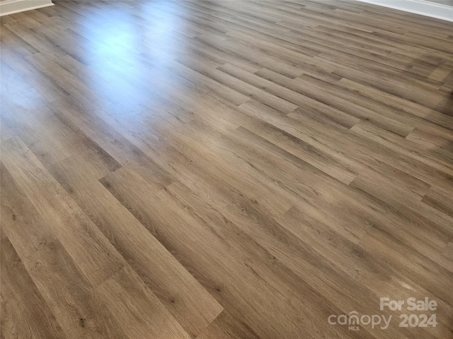 interior details featuring hardwood / wood-style flooring