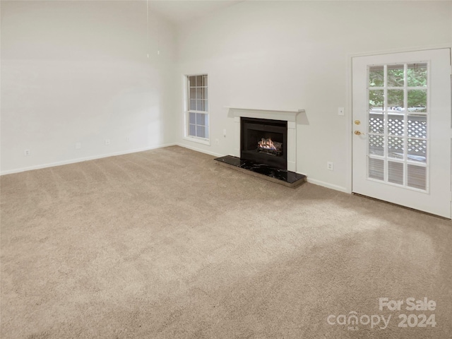 unfurnished living room with carpet flooring