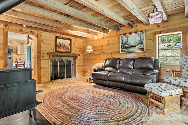 living room featuring beamed ceiling and wooden ceiling