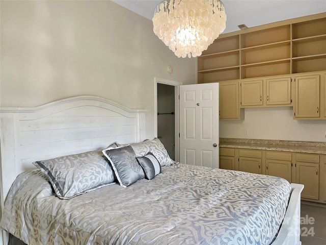 bedroom featuring a high ceiling and a chandelier