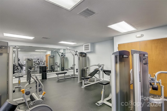 workout area featuring a textured ceiling