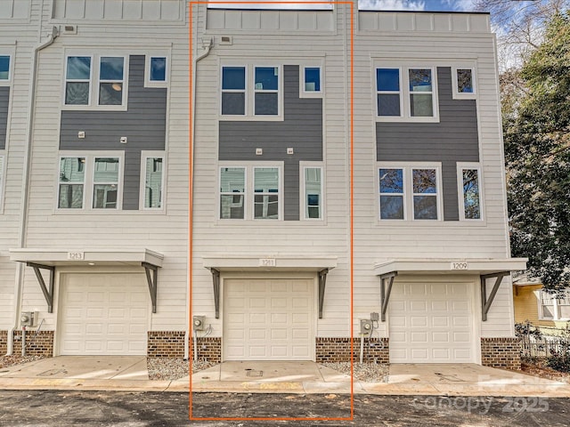 multi unit property featuring board and batten siding and brick siding