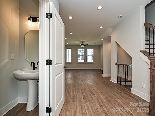 bathroom with ceiling fan, baseboards, wood finished floors, and recessed lighting