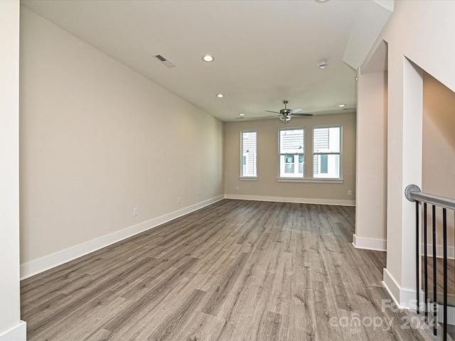 unfurnished room featuring ceiling fan and light hardwood / wood-style floors