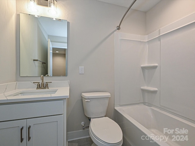 full bathroom featuring tile patterned floors, toilet, vanity, and tub / shower combination