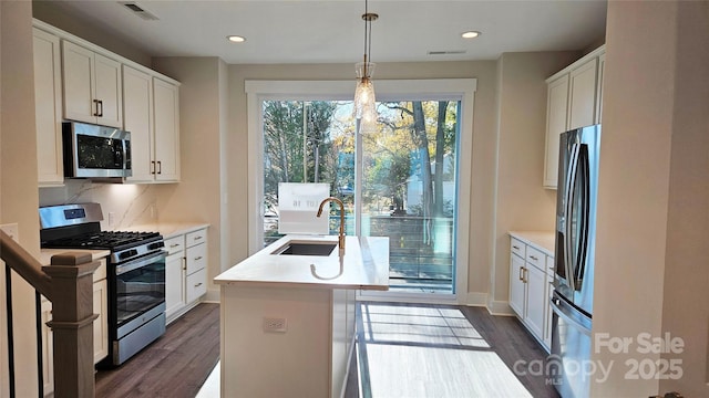 1217 E 34th St Unit Csw0316, Charlotte, NC 28205 - kitchen with a sink, light countertops, appliances with stainless steel finishes, dark wood-type flooring, and visible vents
