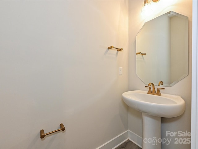 1217 E 34th St Unit Csw0316, Charlotte, NC 28205 - bathroom featuring baseboards and a sink