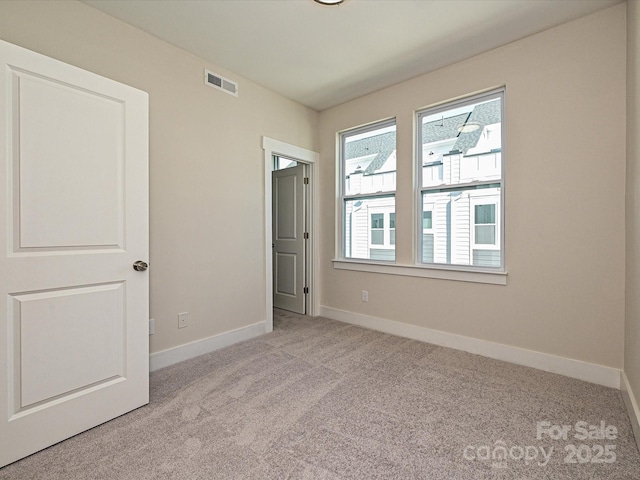 1217 E 34th St Unit Csw0316, Charlotte, NC 28205 - empty room featuring baseboards, visible vents, and carpet floors