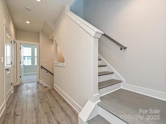 1217 E 34th St Unit Csw0316, Charlotte, NC 28205 - stairs featuring baseboards, wood finished floors, visible vents, and recessed lighting