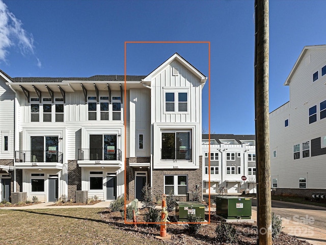 view of front of home featuring board and batten siding and central air condition unit