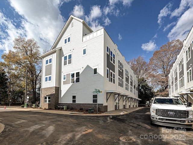 view of property exterior featuring brick siding