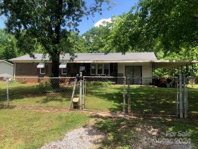 ranch-style home with a front lawn