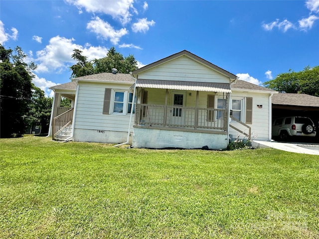 bungalow-style home with a front lawn, a porch, and a carport