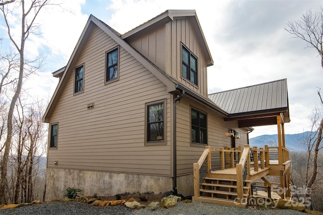 view of side of home with a mountain view