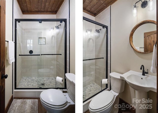 bathroom with wood ceiling, toilet, and walk in shower