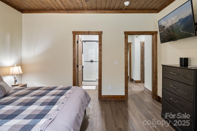 bedroom featuring dark wood-type flooring, wooden ceiling, and ensuite bathroom