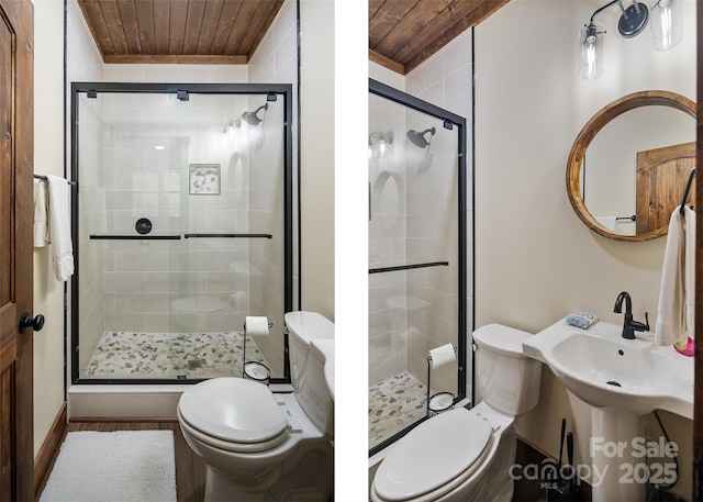 bathroom featuring wood ceiling, toilet, and a shower with shower door