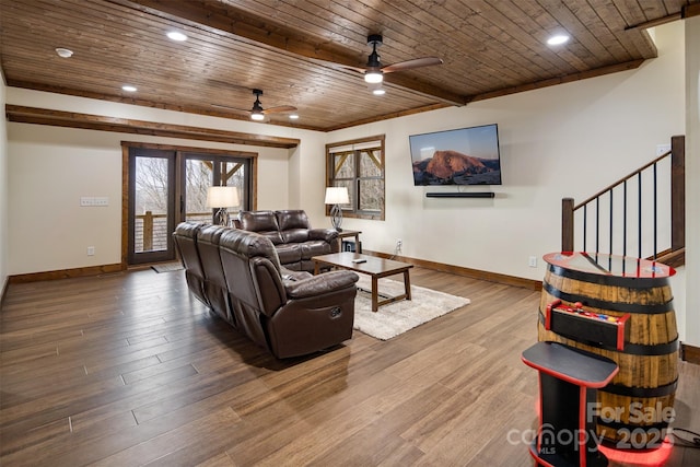 living room with beam ceiling, wood-type flooring, wooden ceiling, and ceiling fan