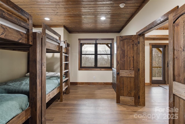 unfurnished bedroom with hardwood / wood-style floors and wooden ceiling