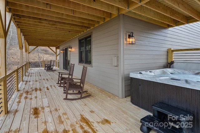 wooden terrace featuring a hot tub