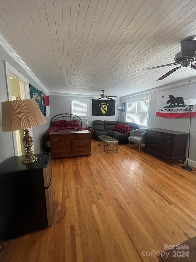 living room with ceiling fan, hardwood / wood-style flooring, and wood ceiling