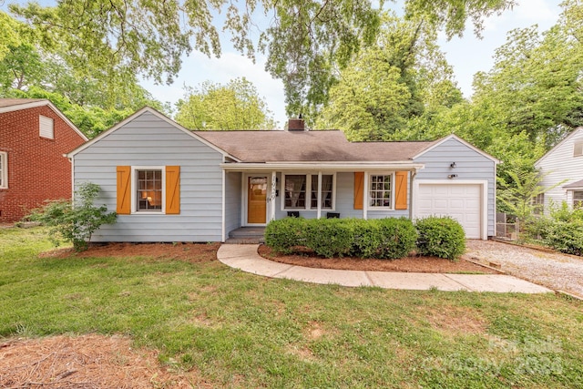 ranch-style house with a garage, a front yard, and a porch