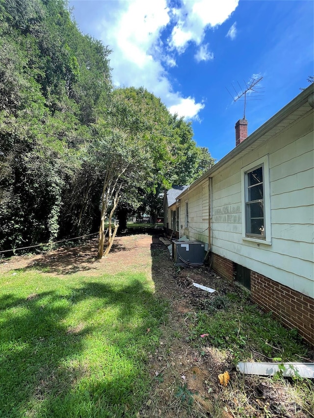 view of yard featuring central AC